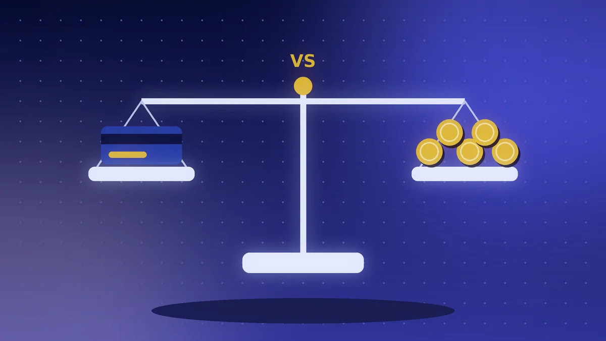 Balance scale with a bank card on one side and gold coins on the other