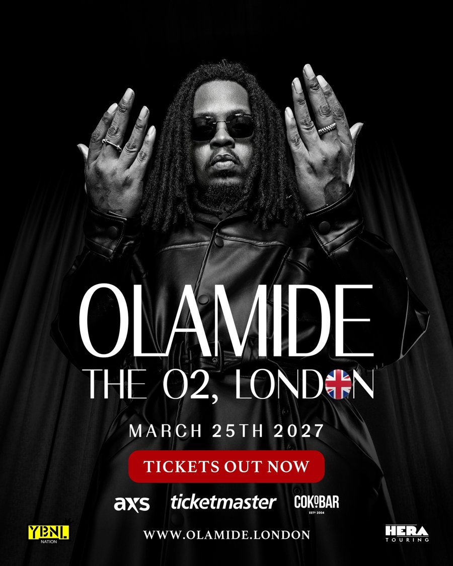 Official poster for Olamide at The O2, London on March 25th 2027, showing Olamide in dark sunglasses and a black leather coat with both hands raised, and the words Tickets out now